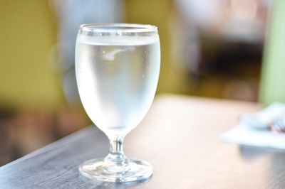 Close-up of wineglass on table