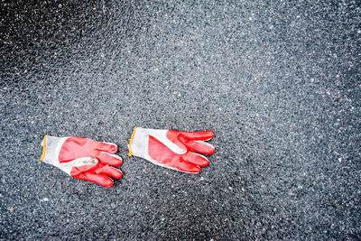 High angle view of gloves on road