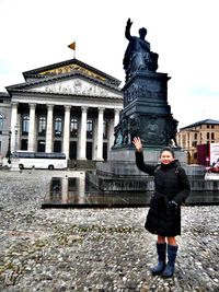 Full length of woman standing in city