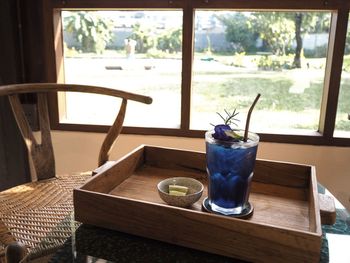 Glass of drink on table