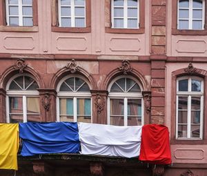 Low angle view of clothes drying against building