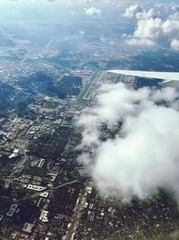 High angle view of city buildings against sky