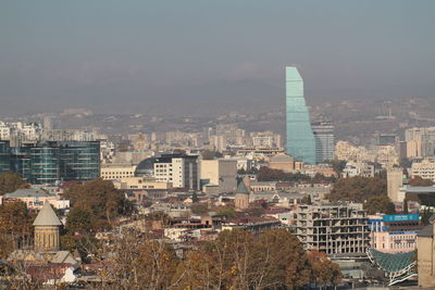 High angle view of buildings in city against sky