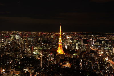 High angle view of city lit up at night