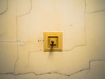 Close-up of telephone booth on wall