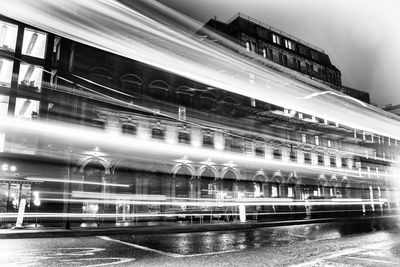 Blurred motion of illuminated building in city