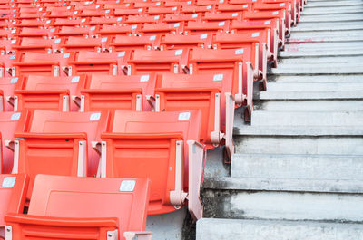 Empty orange seats at stadium,rows of seat on a soccer stadium