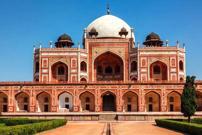 Facade of historic building against clear sky