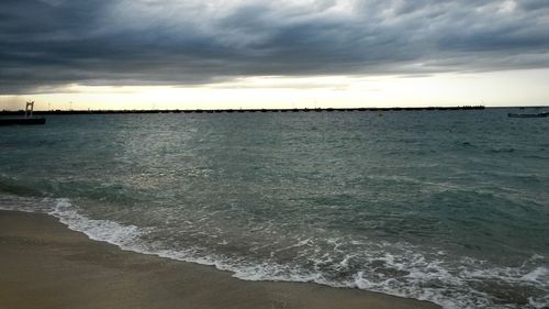 Scenic view of sea against dramatic sky