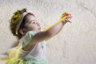 Side view of a girl looking up