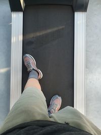 Low section of man wearing canvas shoes