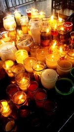 Close-up of illuminated tea light candles