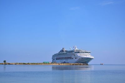 Ship in sea against blue sky