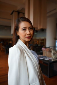 Portrait of woman standing indoors