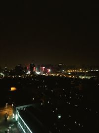 Illuminated cityscape at night