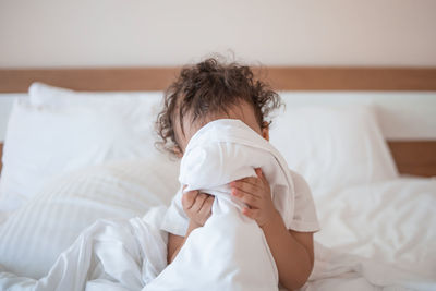 Young woman sleeping on bed at home