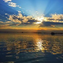 Scenic view of calm sea at sunset