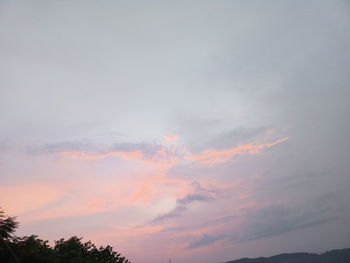 Low angle view of dramatic sky during sunset