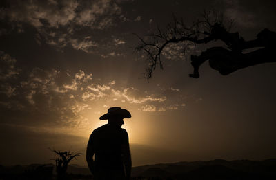 Silhouette of adult man standing on desert during sunset. almeria, spain