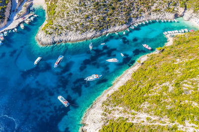 High angle view of people swimming in sea