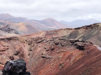 Scenic view of volcanic landscape against sky