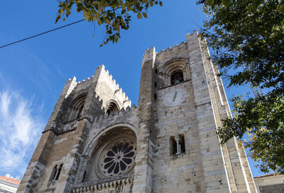 Low angle view of lisbon cathedral against sky