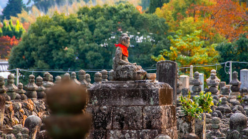 Statue of buddha against trees