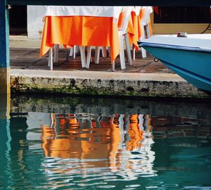 Close-up of clothes drying against water