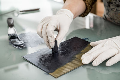 Close up of a hand preparing ink for an art print. printing work