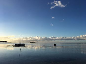 Scenic view of sea against blue sky