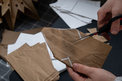 Cropped hand of person holding paper