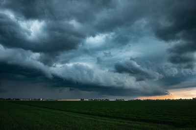 Approaching shelf cloud of a thunderstorm in the evening light