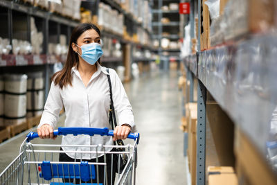 Full length of woman standing in store