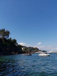 Scenic view of sea against clear blue sky