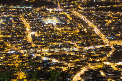 High angle view of illuminated buildings in city at night