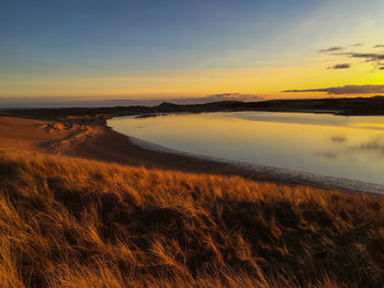 Scenic view of sea at sunset