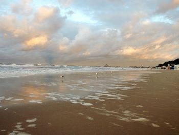 Scenic view of beach at sunset