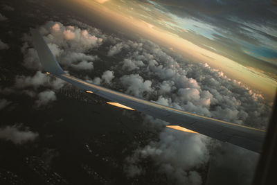 Aerial view of clouds seen through airplane window