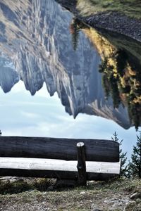 Scenic view of lake by snow covered land
