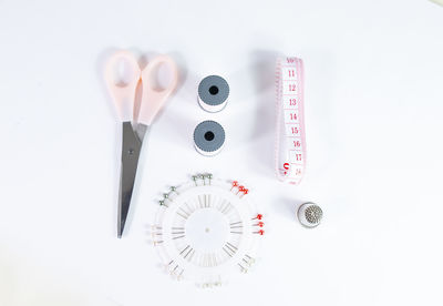 Directly above shot of equipment against white background