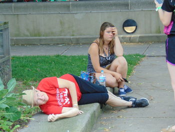 Young woman sitting outdoors