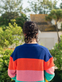 Rear view of man standing against plants