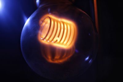 Close-up of illuminated light bulb