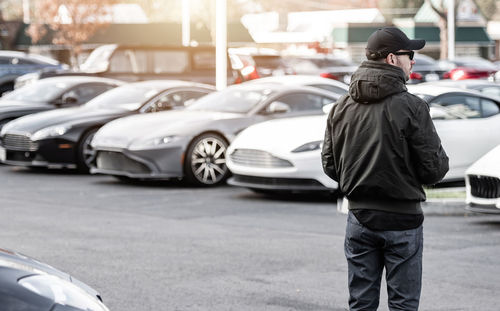 Rear view of man standing at street