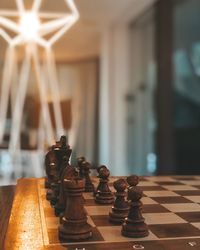 Close-up of chess pieces on table