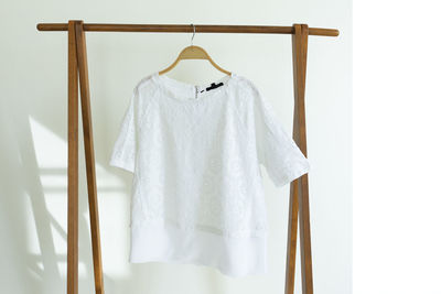 Close-up of clothes drying on white background