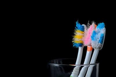 Close-up of artificial flower against black background