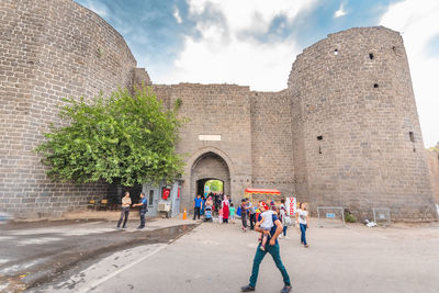 Group of people in front of historical building