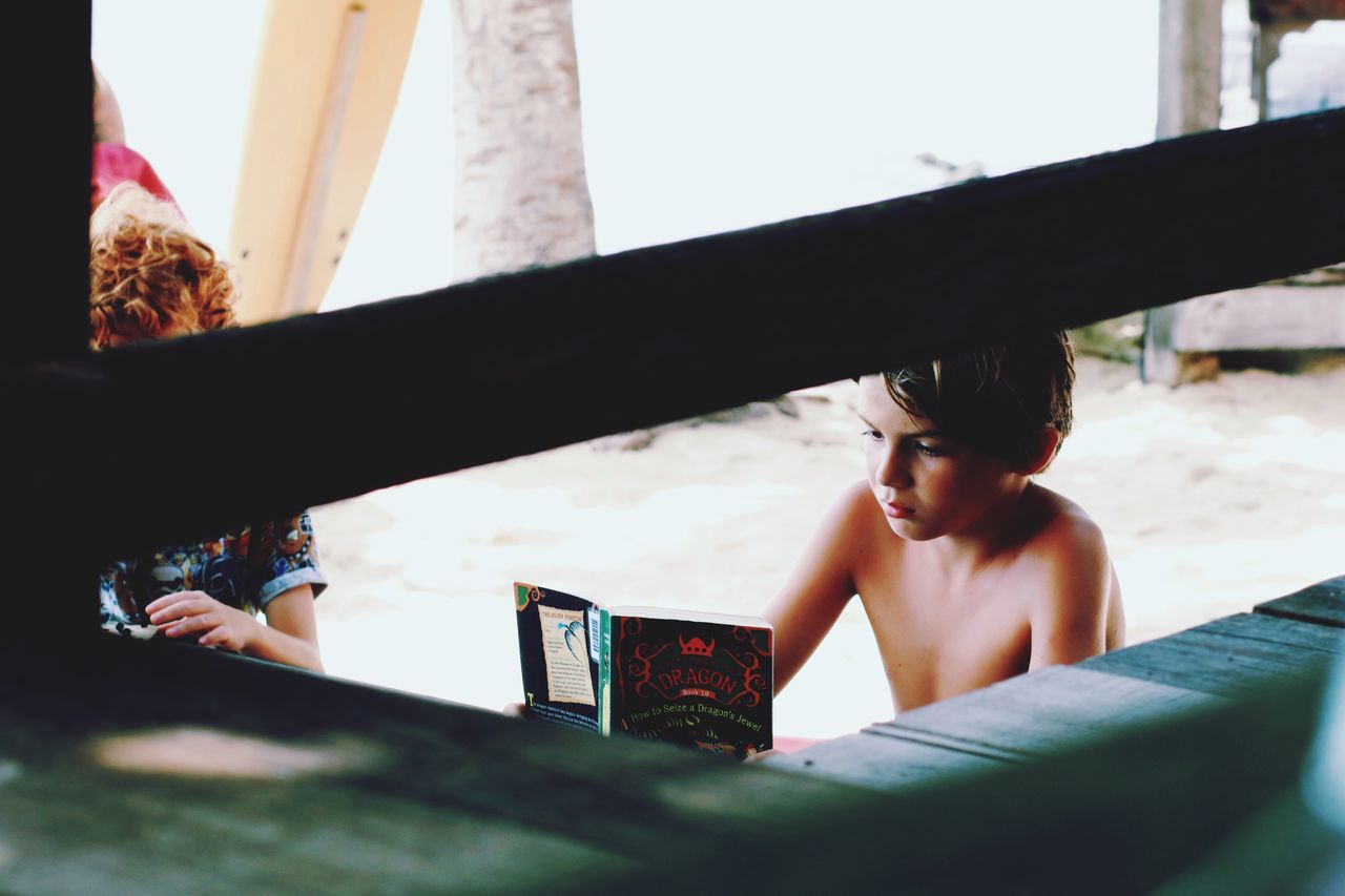 real people, one person, child, headshot, leisure activity, childhood, portrait, lifestyles, boys, indoors, holding, day, selective focus, nature, sitting, women, males, innocence