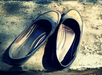 Close-up of shoes on table